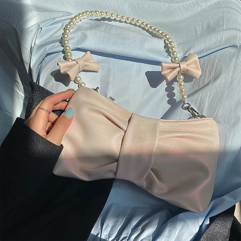 Elegant Satin Clutch with Exquisite Pearl Handle