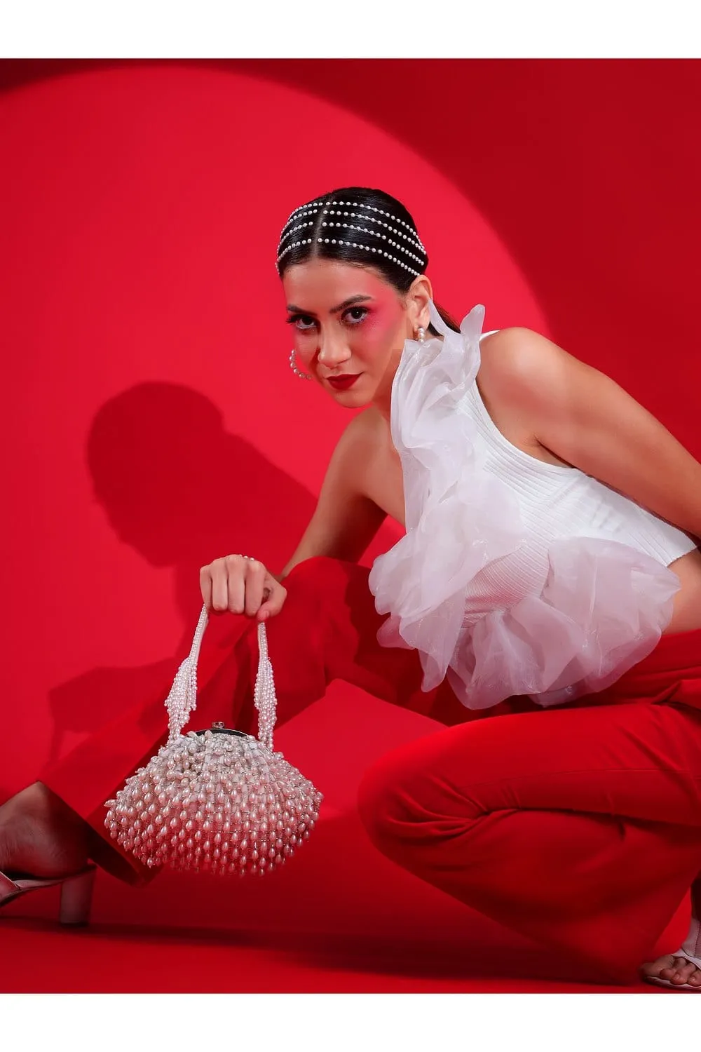 White Purse With Handcrafted Pearls Detailing An Ideal Bridal Bag